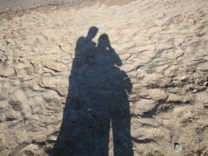 shadow_on_beach___couple_by_merteral